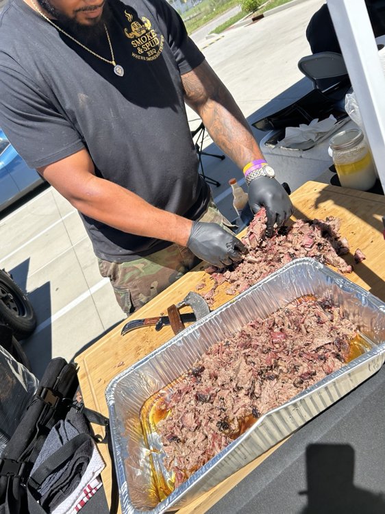 Smoke & Spud team preparing brisket for serving