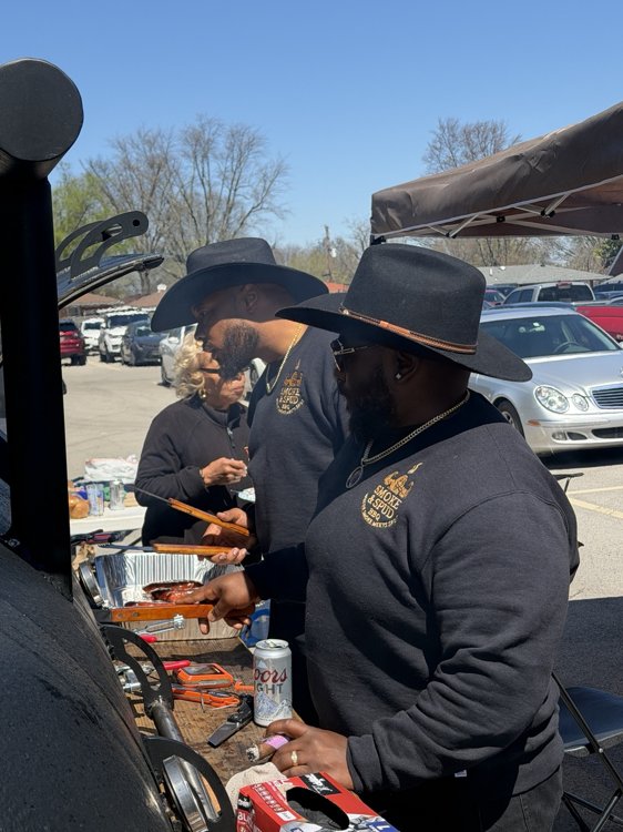 Smoke & Spud team serving food at an outdoor pop-up